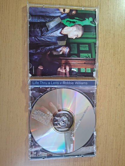 Robbie Williams – Life Thru A Lens (1997) — Second-Hand CD